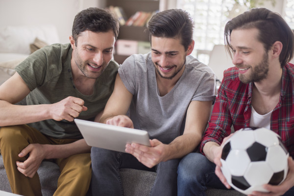 men-watching-video-tablet